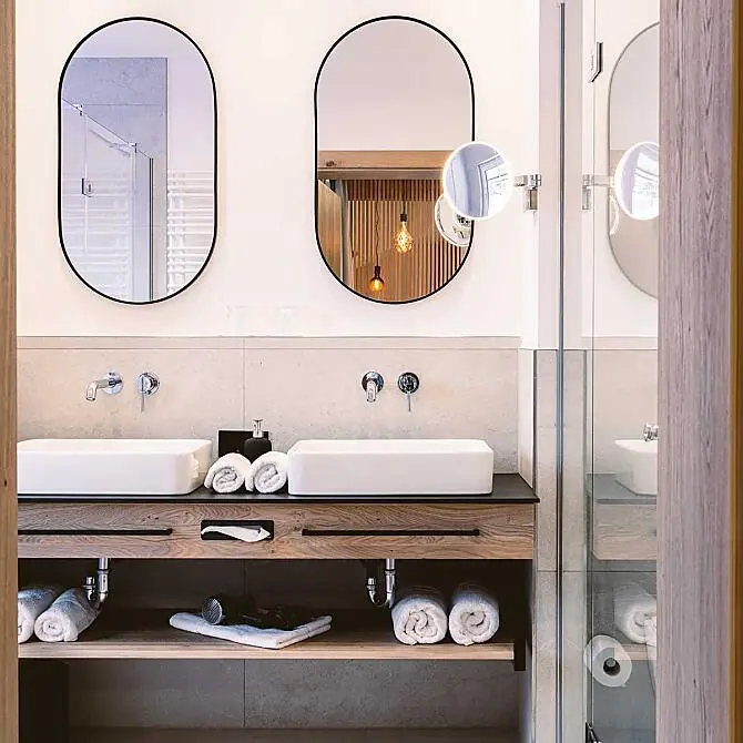 Moderner Waschtisch mit Naturstein und Holzverkleidung im Badezimmer der Ferienwelt Kesselgrub